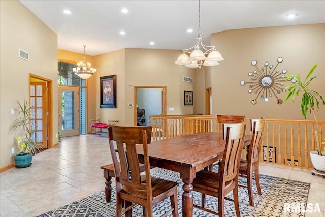 dining space with a notable chandelier and high vaulted ceiling