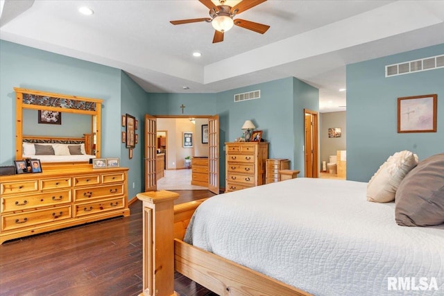 bedroom with ceiling fan and dark wood-type flooring