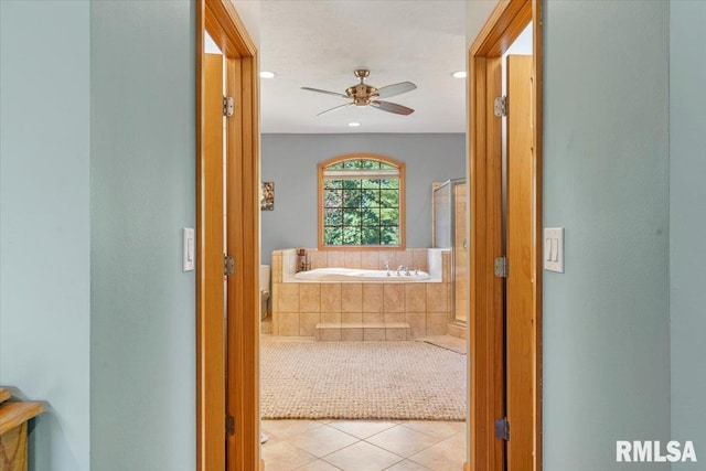 corridor featuring light tile patterned floors