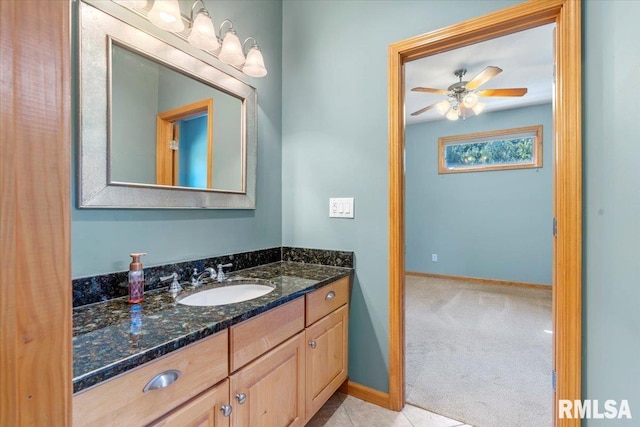 bathroom featuring ceiling fan and vanity