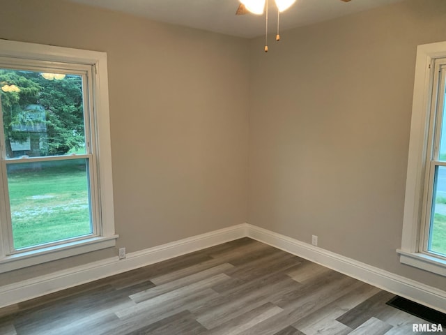 unfurnished room with hardwood / wood-style floors and ceiling fan