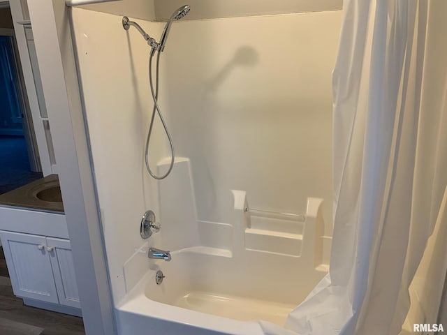 bathroom with vanity, shower / tub combo, and hardwood / wood-style flooring