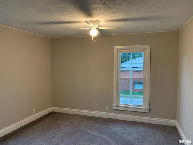 empty room featuring carpet flooring, a textured ceiling, and ceiling fan