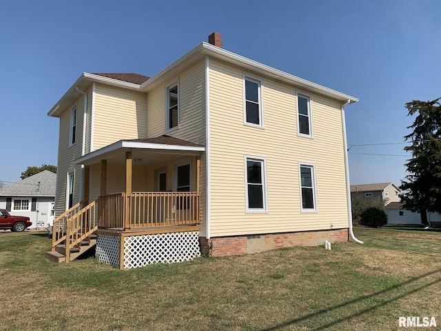 exterior space with a porch and a lawn