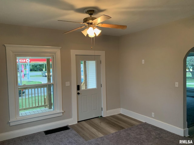 entrance foyer with ceiling fan and dark hardwood / wood-style floors