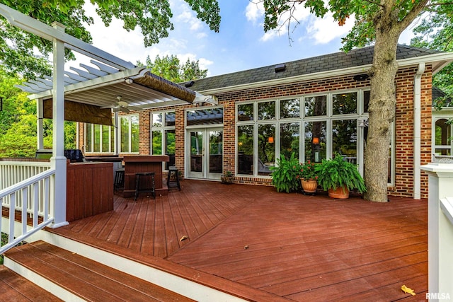 wooden deck featuring a pergola