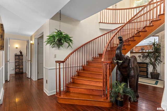 stairs featuring wood-type flooring