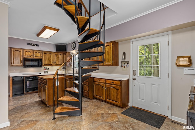 kitchen featuring ornamental molding, black appliances, and sink