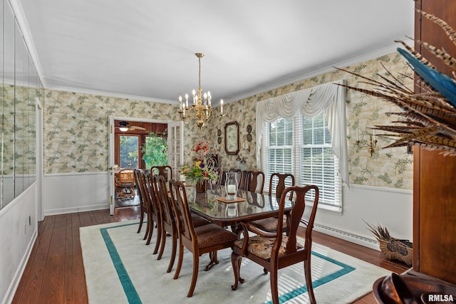 dining space featuring an inviting chandelier, dark hardwood / wood-style floors, crown molding, and a healthy amount of sunlight