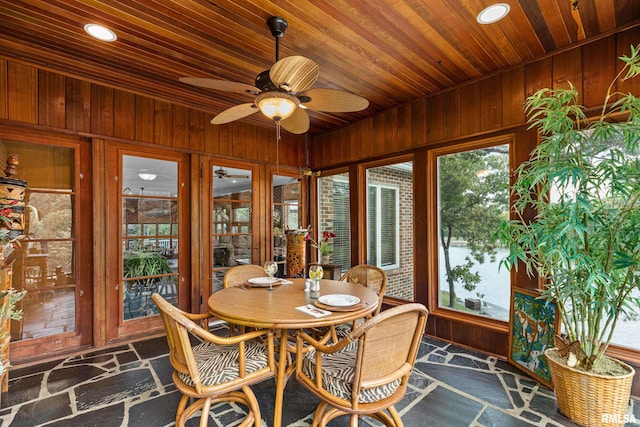 sunroom / solarium featuring wood ceiling and ceiling fan