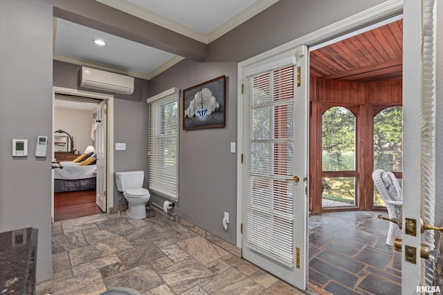 interior space with ornamental molding, wood ceiling, toilet, and a wall mounted AC