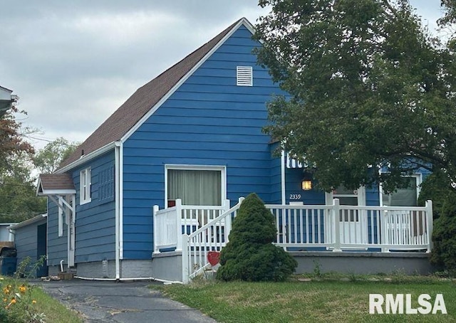 view of side of home featuring a porch