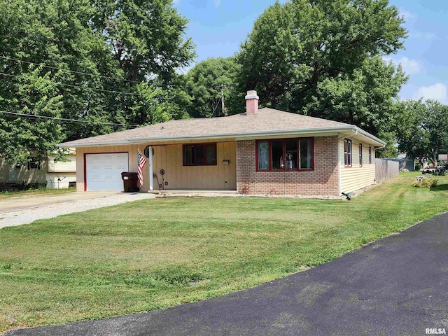 ranch-style home with a garage and a front lawn