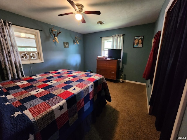 carpeted bedroom with ceiling fan