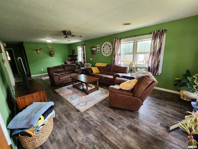 living room with dark hardwood / wood-style floors and ceiling fan