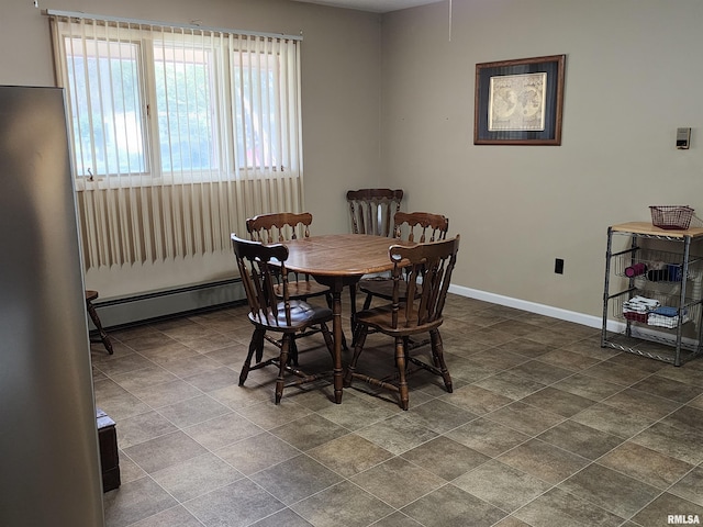 dining room with a baseboard heating unit