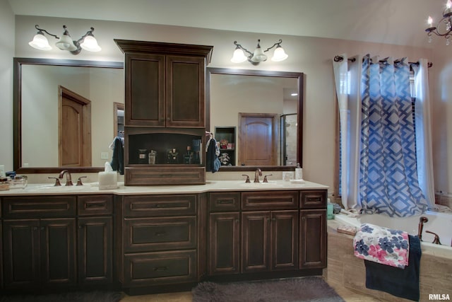 bathroom with vanity and a chandelier