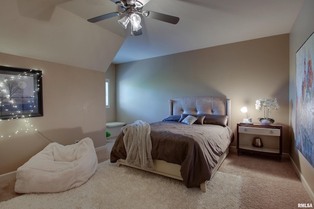 carpeted bedroom featuring lofted ceiling and ceiling fan