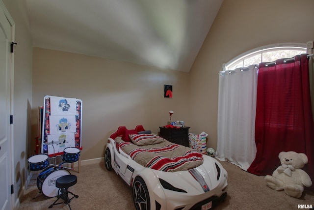 carpeted bedroom featuring lofted ceiling