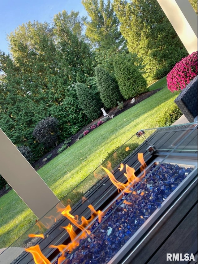 view of yard with a fire pit