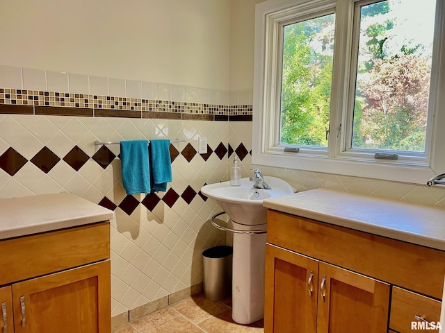 bathroom featuring tile patterned flooring and tile walls