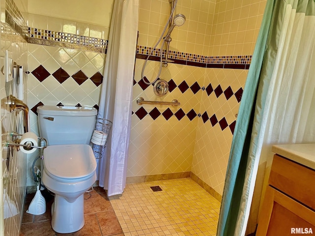 bathroom with toilet, tile walls, tile patterned floors, and a shower with shower curtain