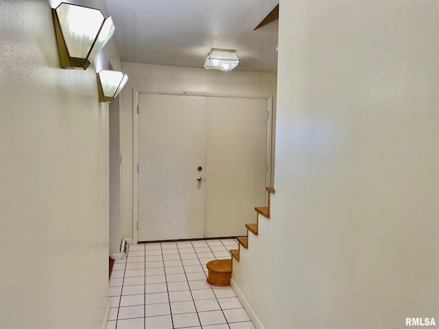 entryway featuring light tile patterned flooring