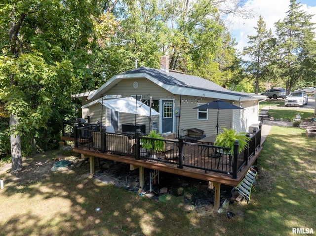 rear view of house with a deck