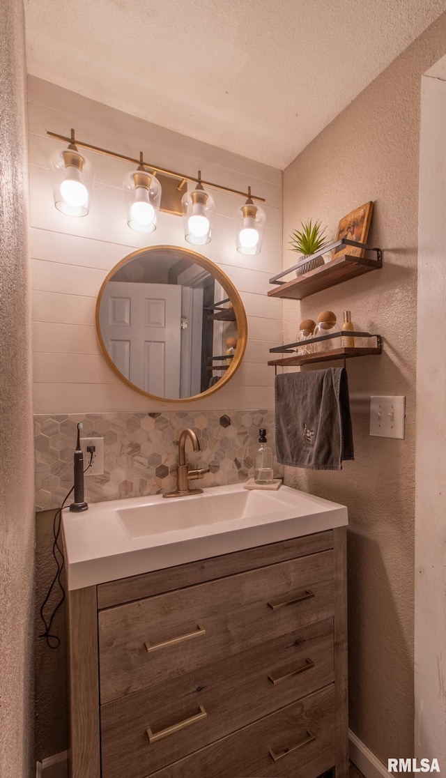 bathroom with vanity and a textured ceiling