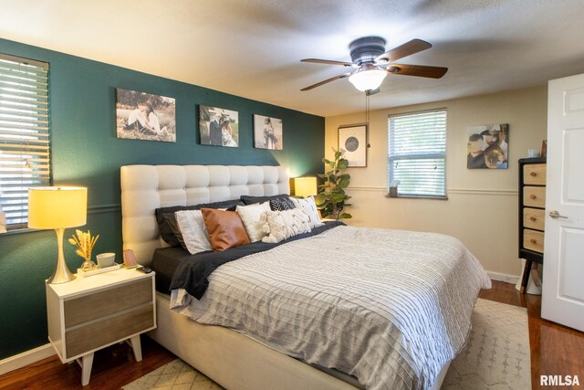 bedroom featuring ceiling fan and hardwood / wood-style floors