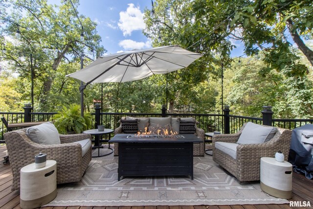 view of patio / terrace featuring area for grilling, an outdoor living space with a fire pit, and a deck