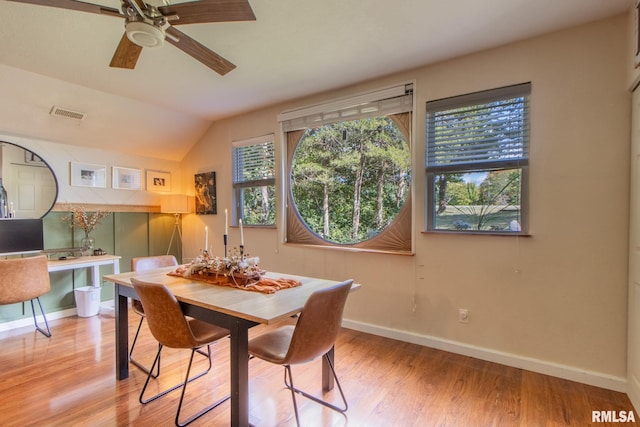 dining area with vaulted ceiling, light hardwood / wood-style floors, and ceiling fan