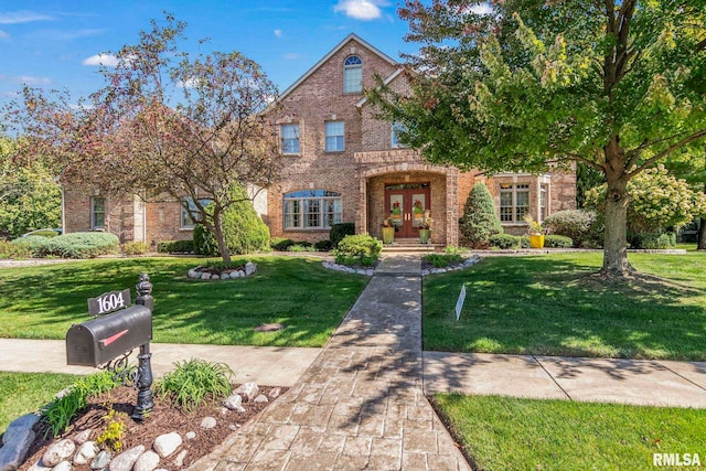 tudor home with a front lawn and french doors