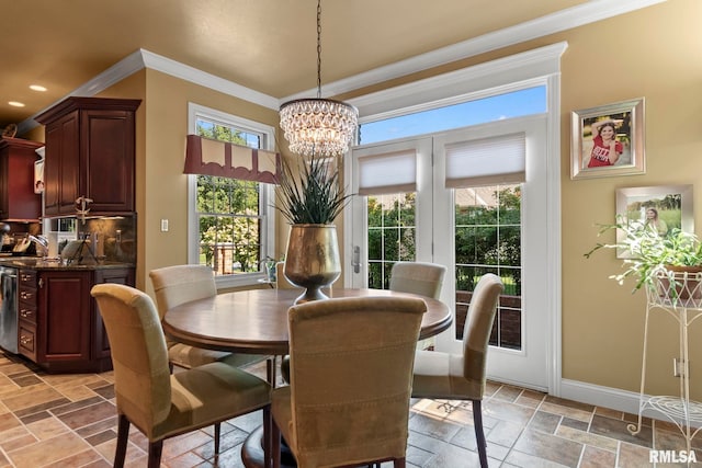 dining room featuring a notable chandelier and crown molding