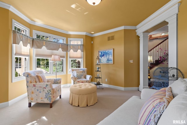 carpeted living room featuring ornamental molding and decorative columns