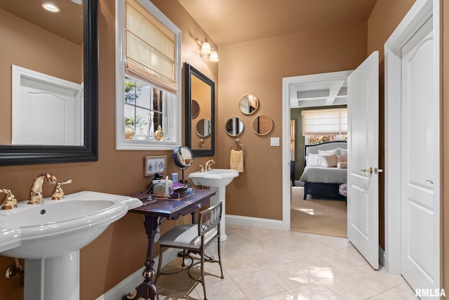 bathroom with plenty of natural light, sink, and tile patterned floors