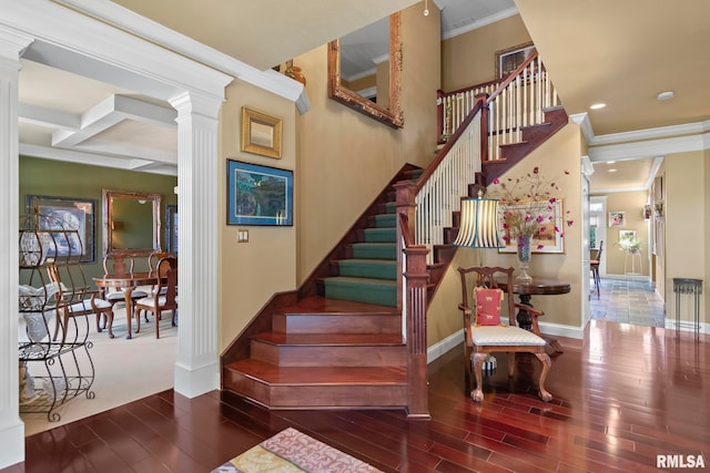 stairway with hardwood / wood-style flooring, beam ceiling, coffered ceiling, crown molding, and ornate columns