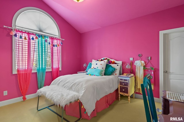 bedroom with carpet flooring and vaulted ceiling