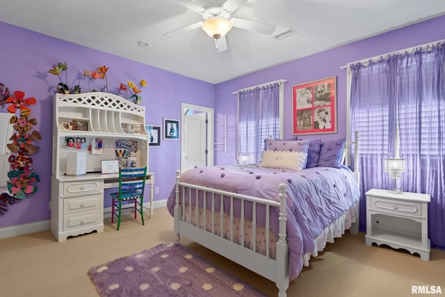 bedroom featuring carpet, multiple windows, and ceiling fan