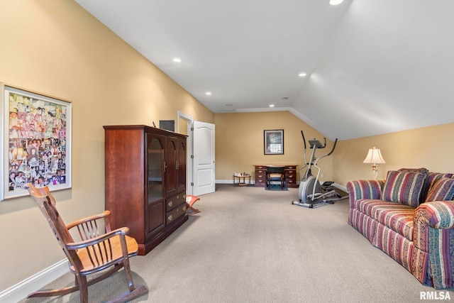 sitting room featuring light colored carpet and lofted ceiling