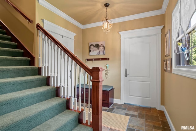 entrance foyer featuring crown molding and an inviting chandelier