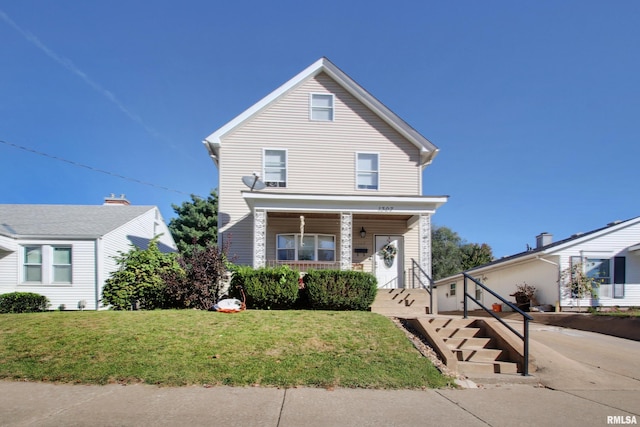 view of property featuring a front lawn