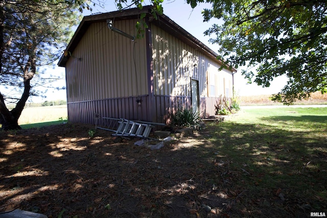 view of home's exterior with a yard