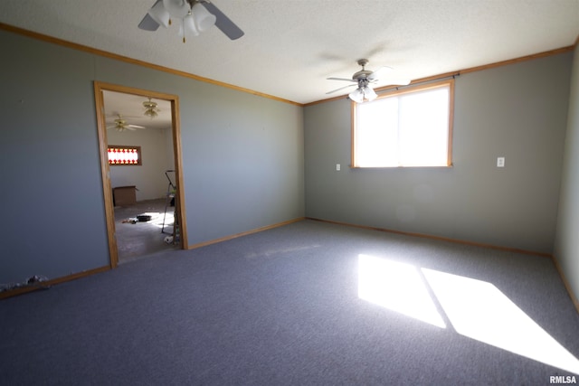 spare room featuring ceiling fan, a textured ceiling, crown molding, and carpet flooring