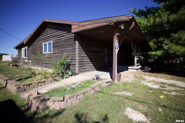 view of home's exterior with a patio