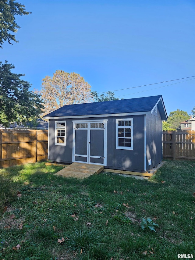 view of outbuilding with a lawn