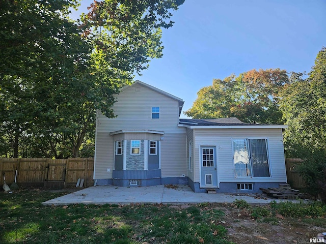 rear view of property featuring a patio