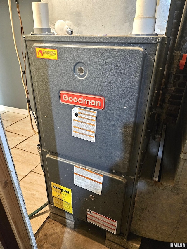 utility room featuring heating unit