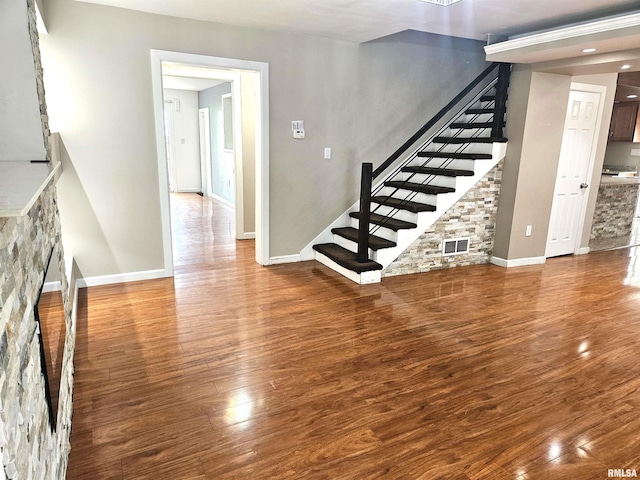 unfurnished living room featuring hardwood / wood-style flooring