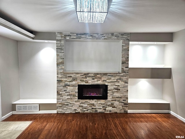 unfurnished living room with wood-type flooring